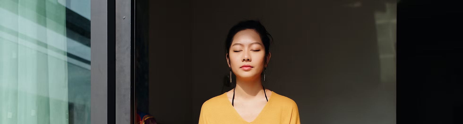 A woman meditating.