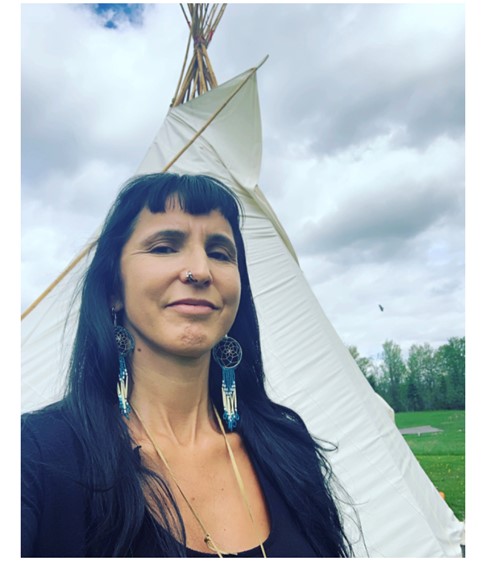 Dr. Ethsi standing in front of a tepe