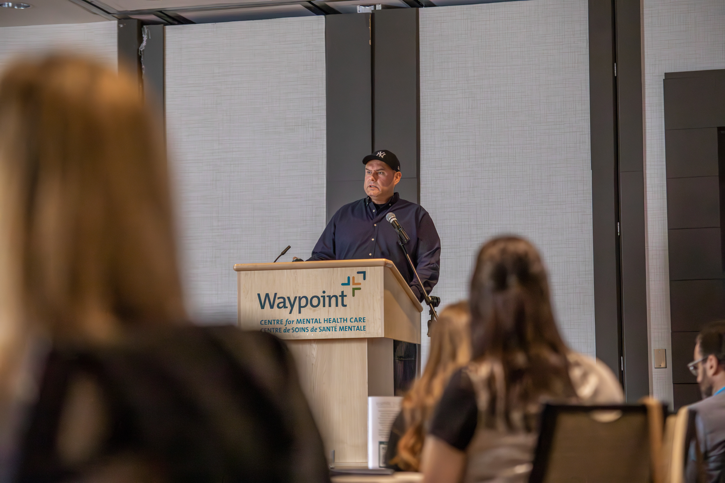 Jesse Thistle at the podium at the InSPIRE conference.