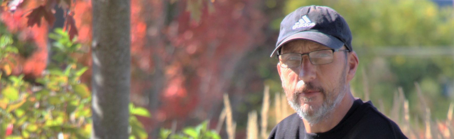 Adam sitting at a bench