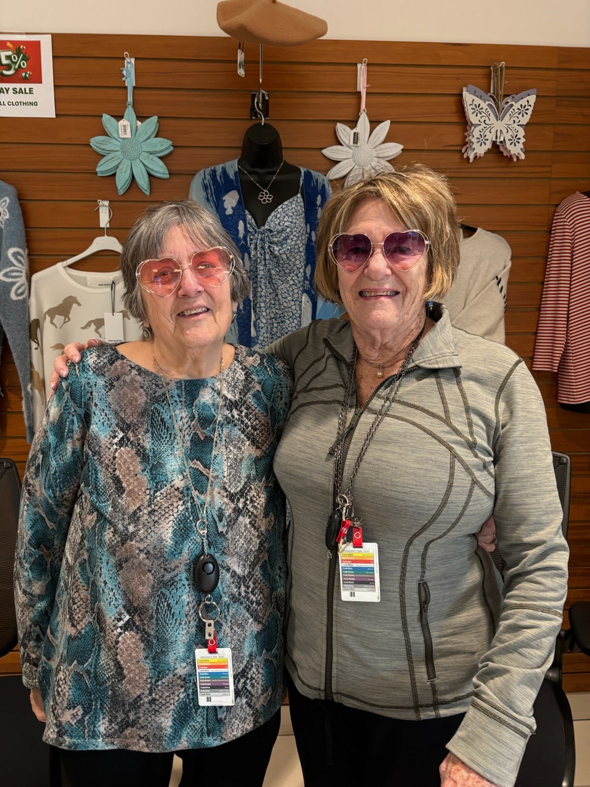 two of waypoint's gift shop volunteers wearing sunglasses