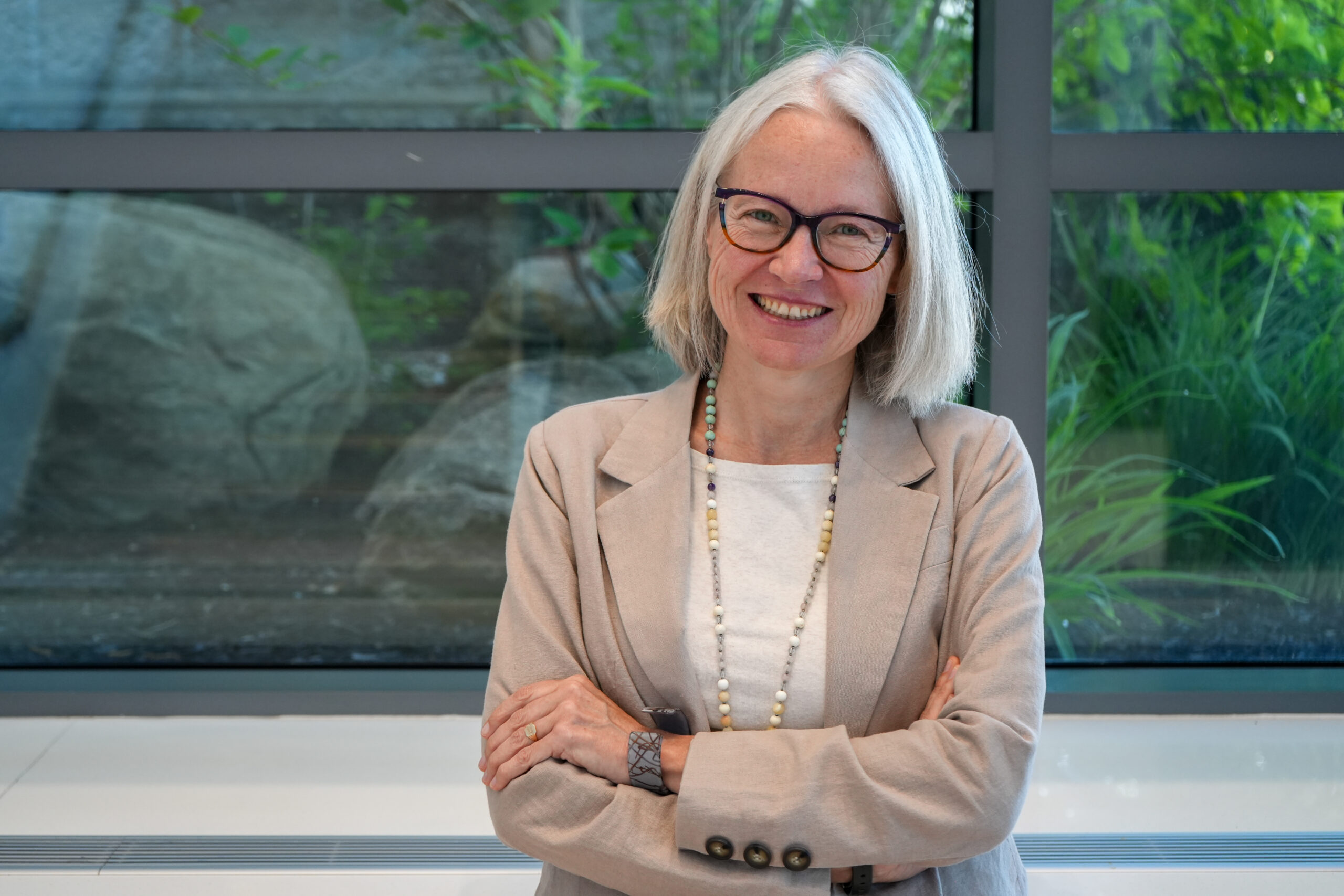 Dr. Andrea Waddell in front of a window
