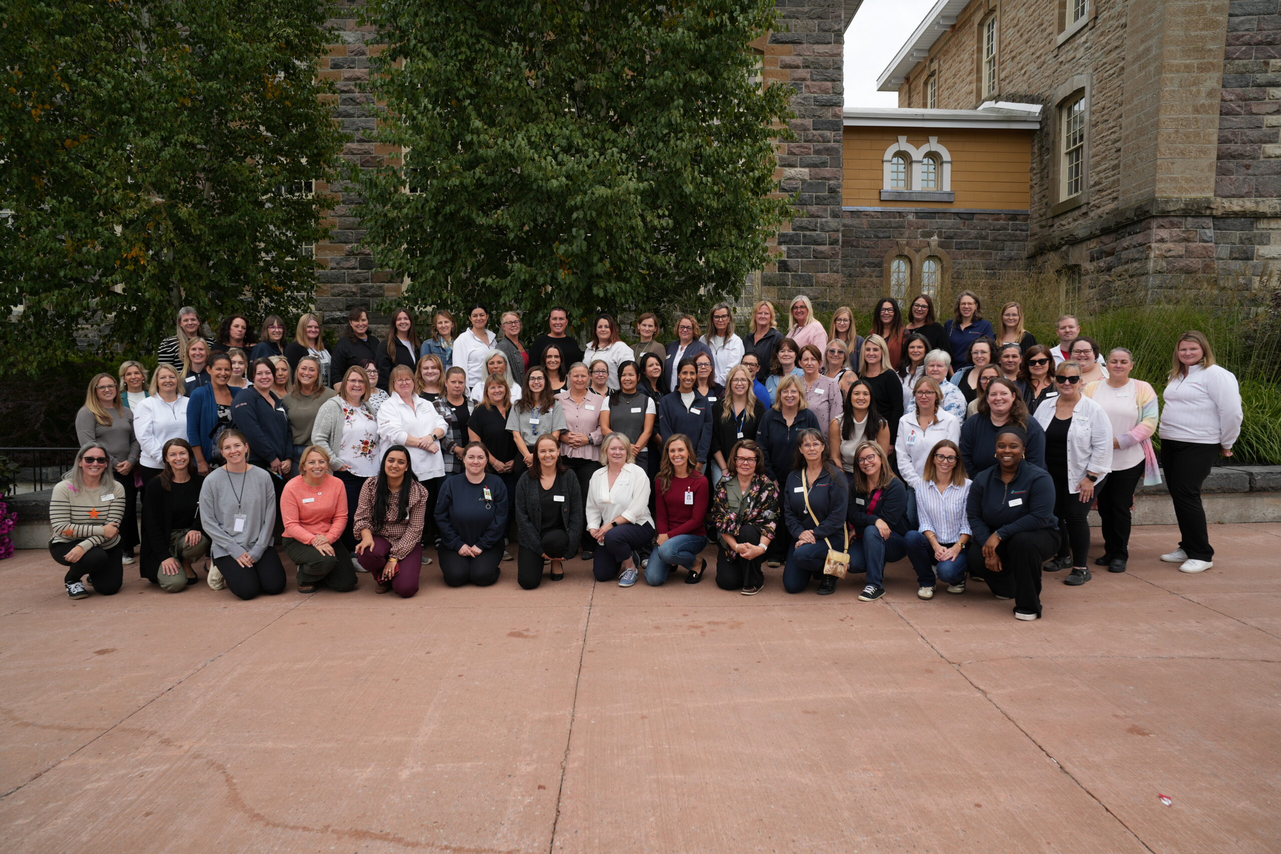 The full NSMSGS team stand for a group photo in front of Waypoint Centre for Mental Health.