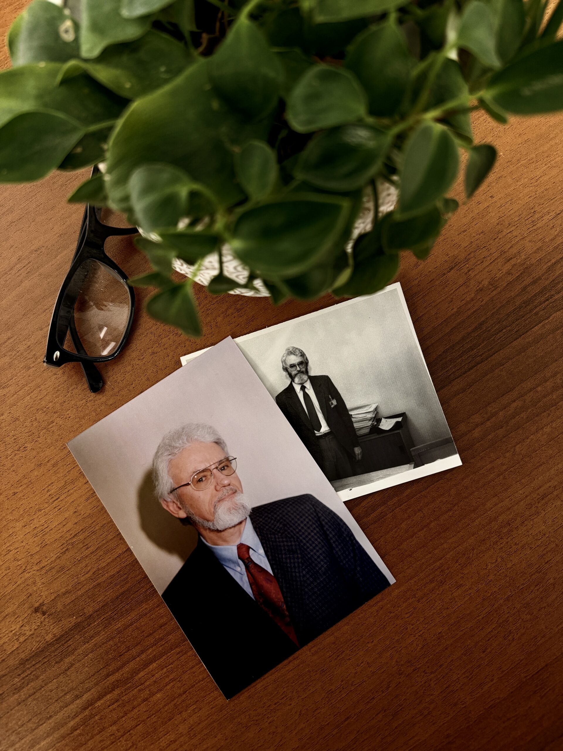 two pictures of Dr. Fleming on a table